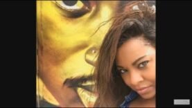 Ayanna Jackson [2Pac alleged rape victim] takes a picture in front of his mural